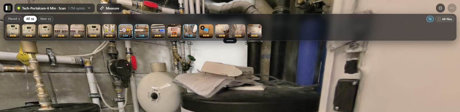 Inside the copy: a strip of sixteen photographs and clips pinned in place along the top of the room.
